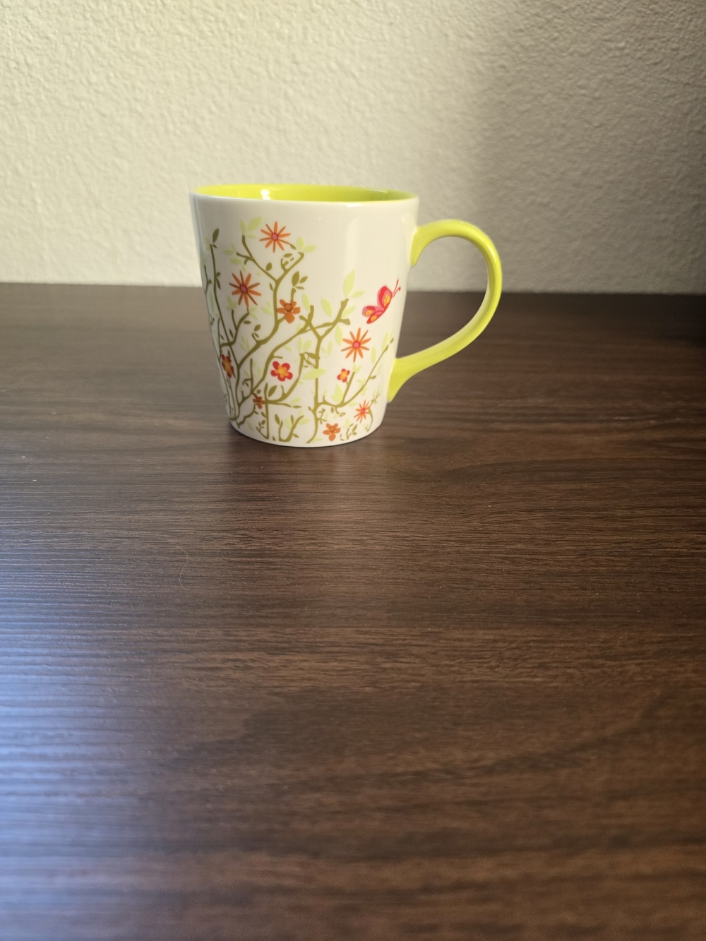 Starbucks White Ceramic Mug with Yellow Interior and Handle and Floral Accent